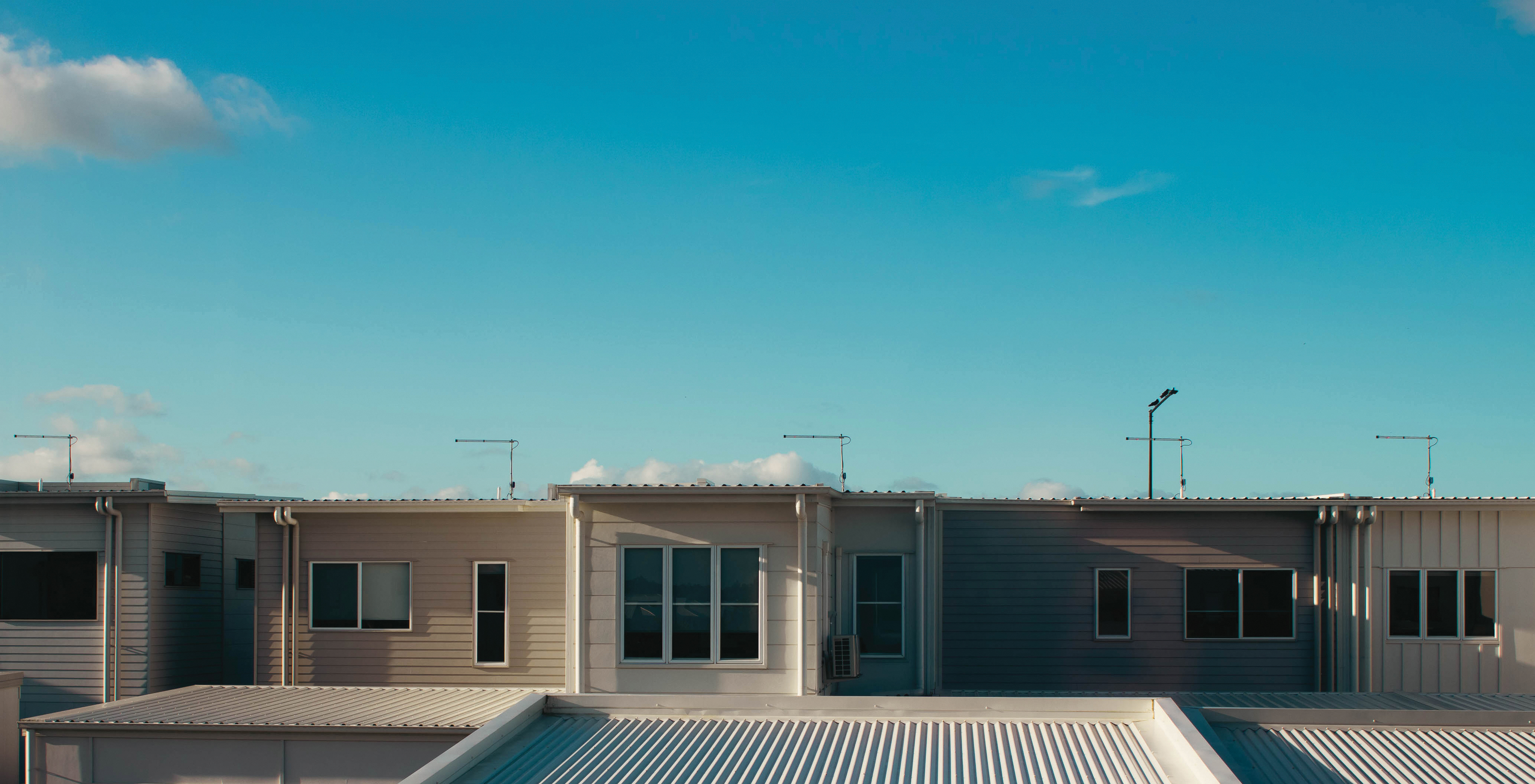 Roof and windows of suburban town houses